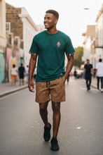 AMO Lekker T-Shirt in Green styled with Leopard Weave shweshwe shorts — handmade in Lavender Hill, Cape Town