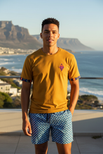 AMO Lekker T-Shirt in Mustard styled with Ocean Weave shweshwe shorts — made in Cape Town, South Africa